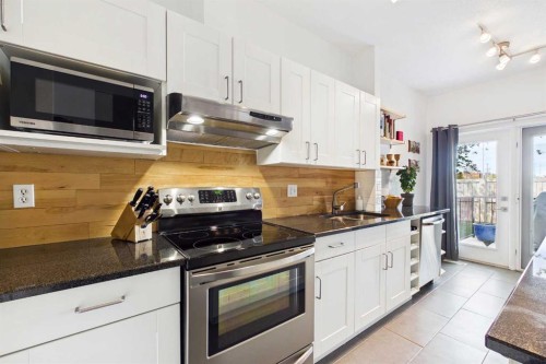 144 Simcoe Place Sw, Calgary, AB - Indoor Photo Showing Kitchen With Double Sink