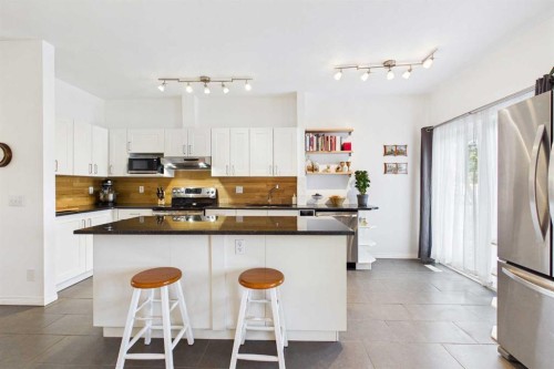 144 Simcoe Place Sw, Calgary, AB - Indoor Photo Showing Kitchen With Stainless Steel Kitchen