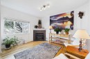 144 Simcoe Place Sw, Calgary, AB  - Indoor Photo Showing Living Room With Fireplace 