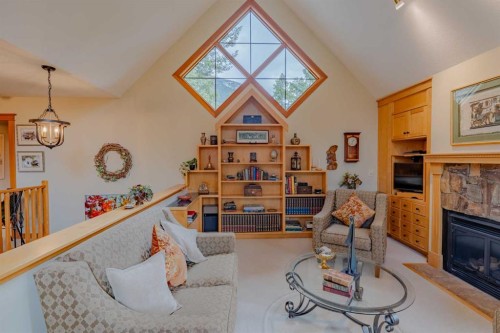 14 Blue Grouse Ridge, Canmore, AB - Indoor Photo Showing Living Room With Fireplace