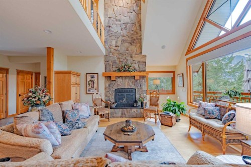 14 Blue Grouse Ridge, Canmore, AB - Indoor Photo Showing Living Room With Fireplace