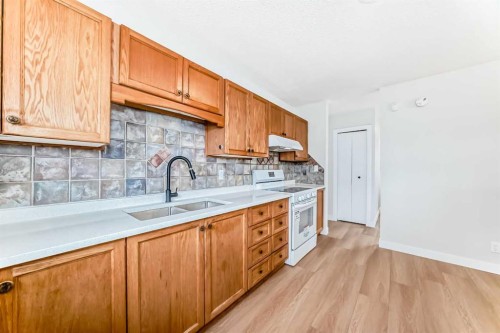 4607 Marwood Way Ne, Calgary, AB - Indoor Photo Showing Kitchen With Double Sink
