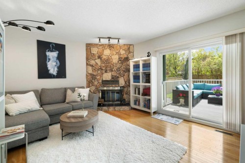14207 Deer Run Boulevard Se, Calgary, AB - Indoor Photo Showing Living Room With Fireplace
