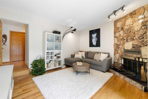 14207 Deer Run Boulevard Se, Calgary, AB - Indoor Photo Showing Living Room With Fireplace