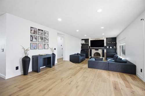 76 Beaconsfield Way Nw, Calgary, AB - Indoor With Fireplace