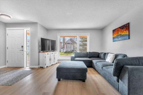 38 Tuscany Valley Heights Nw, Calgary, AB - Indoor Photo Showing Living Room