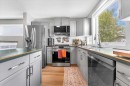 38 Tuscany Valley Heights Nw, Calgary, AB  - Indoor Photo Showing Kitchen With Double Sink With Upgraded Kitchen 