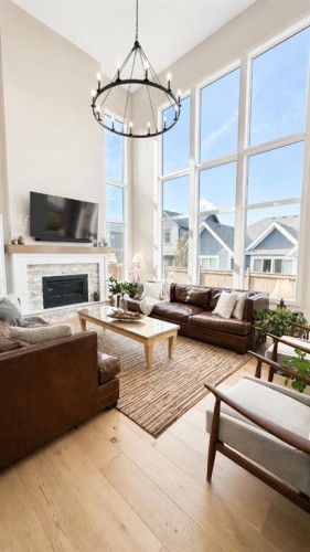 26 Bluerock Avenue Sw, Calgary, AB - Indoor Photo Showing Living Room With Fireplace