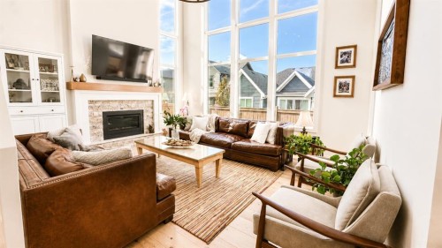 26 Bluerock Avenue Sw, Calgary, AB - Indoor Photo Showing Living Room With Fireplace