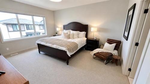 26 Bluerock Avenue Sw, Calgary, AB - Indoor Photo Showing Bedroom