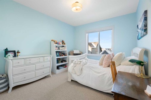 26 Bluerock Avenue Sw, Calgary, AB - Indoor Photo Showing Bedroom