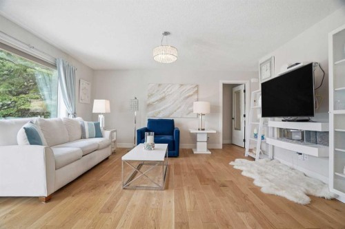 44 Vandoos Gardens Nw, Calgary, AB - Indoor Photo Showing Living Room
