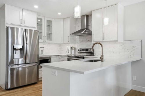 44 Vandoos Gardens Nw, Calgary, AB - Indoor Photo Showing Kitchen With Stainless Steel Kitchen With Upgraded Kitchen