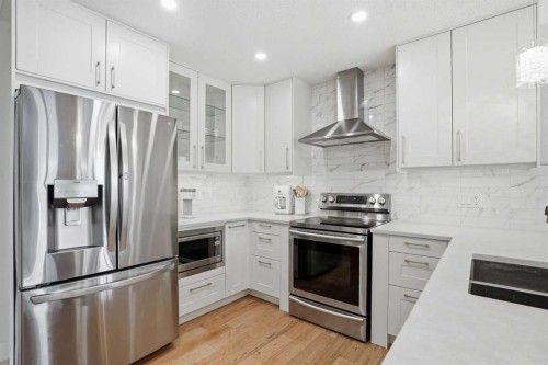 44 Vandoos Gardens Nw, Calgary, AB - Indoor Photo Showing Kitchen With Stainless Steel Kitchen With Double Sink With Upgraded Kitchen