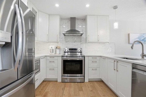 44 Vandoos Gardens Nw, Calgary, AB - Indoor Photo Showing Kitchen With Stainless Steel Kitchen With Upgraded Kitchen