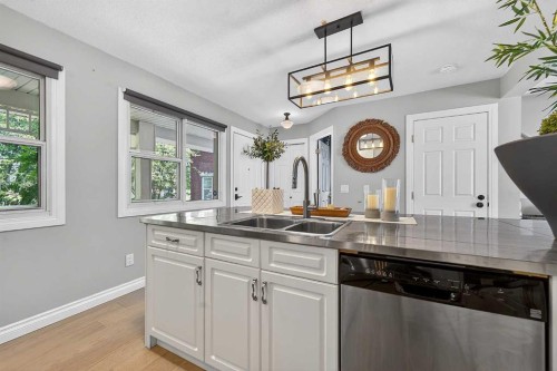 2275 Flanders Avenue Sw, Calgary, AB - Indoor Photo Showing Kitchen With Double Sink