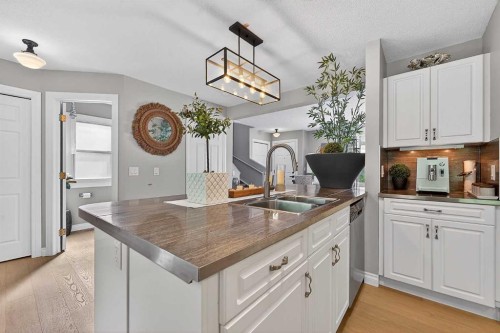 2275 Flanders Avenue Sw, Calgary, AB - Indoor Photo Showing Kitchen With Double Sink