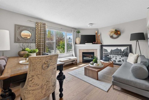 2275 Flanders Avenue Sw, Calgary, AB - Indoor Photo Showing Living Room With Fireplace