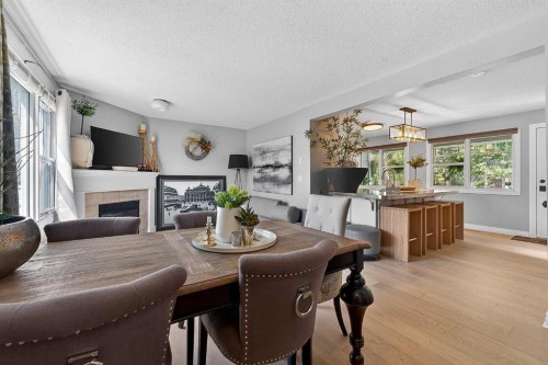 2275 Flanders Avenue Sw, Calgary, AB - Indoor Photo Showing Dining Room With Fireplace