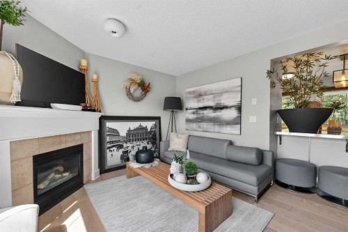 2275 Flanders Avenue Sw, Calgary, AB - Indoor Photo Showing Living Room With Fireplace