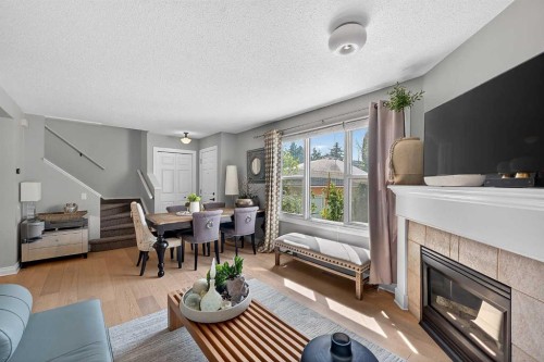 2275 Flanders Avenue Sw, Calgary, AB - Indoor Photo Showing Living Room With Fireplace