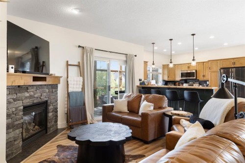 128 Hillcrest Cape, Strathmore, AB - Indoor Photo Showing Living Room With Fireplace