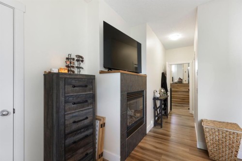 128 Hillcrest Cape, Strathmore, AB - Indoor Photo Showing Other Room With Fireplace