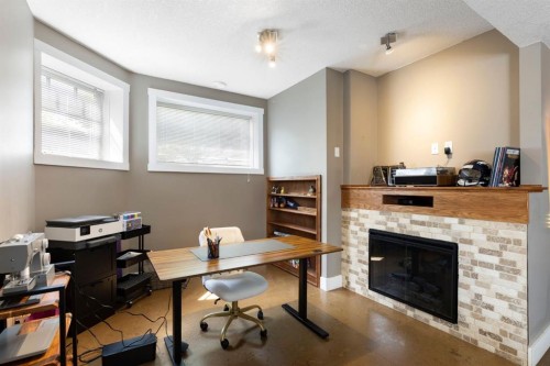 128 Hillcrest Cape, Strathmore, AB - Indoor Photo Showing Office With Fireplace