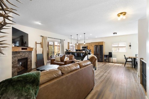 128 Hillcrest Cape, Strathmore, AB - Indoor Photo Showing Living Room With Fireplace