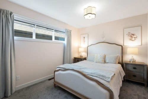 75 Sundown Crescent, Cochrane, AB - Indoor Photo Showing Bedroom
