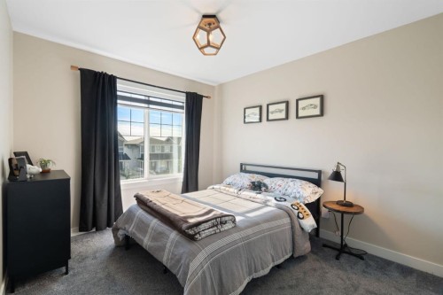 75 Sundown Crescent, Cochrane, AB - Indoor Photo Showing Bedroom