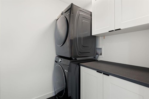 75 Sundown Crescent, Cochrane, AB - Indoor Photo Showing Laundry Room