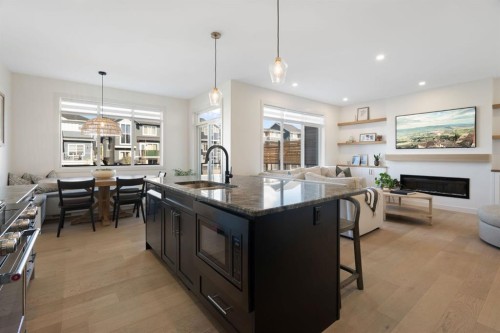 75 Sundown Crescent, Cochrane, AB - Indoor Photo Showing Kitchen With Upgraded Kitchen
