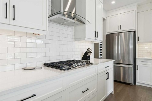 160 Precedence Hill, Cochrane, AB - Indoor Photo Showing Kitchen With Stainless Steel Kitchen With Upgraded Kitchen
