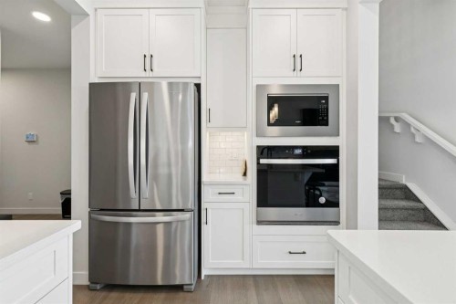 160 Precedence Hill, Cochrane, AB - Indoor Photo Showing Kitchen With Stainless Steel Kitchen