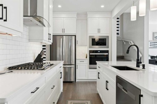 160 Precedence Hill, Cochrane, AB - Indoor Photo Showing Kitchen With Stainless Steel Kitchen With Upgraded Kitchen