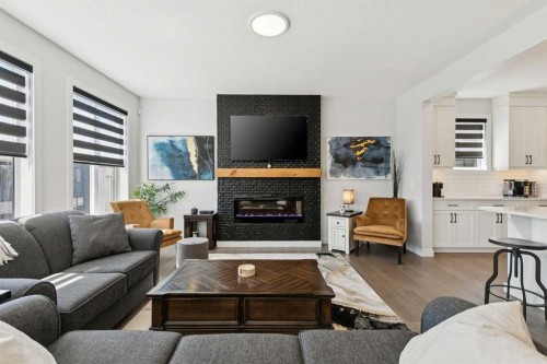 160 Precedence Hill, Cochrane, AB - Indoor Photo Showing Living Room With Fireplace