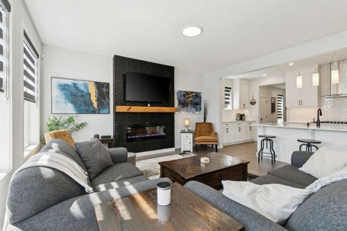160 Precedence Hill, Cochrane, AB - Indoor Photo Showing Living Room With Fireplace
