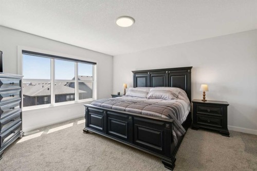 160 Precedence Hill, Cochrane, AB - Indoor Photo Showing Bedroom