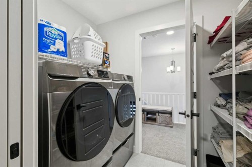 160 Precedence Hill, Cochrane, AB - Indoor Photo Showing Laundry Room