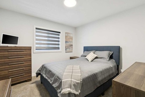 160 Precedence Hill, Cochrane, AB - Indoor Photo Showing Bedroom