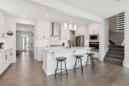 160 Precedence Hill, Cochrane, AB - Indoor Photo Showing Kitchen With Upgraded Kitchen