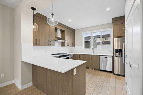 536 Chelsea Gardens, Chestermere, AB - Indoor Photo Showing Kitchen With Stainless Steel Kitchen With Upgraded Kitchen