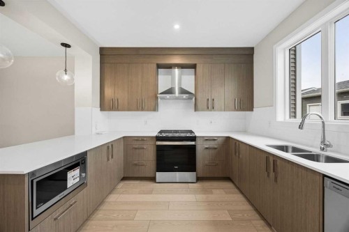 536 Chelsea Gardens, Chestermere, AB - Indoor Photo Showing Kitchen With Double Sink