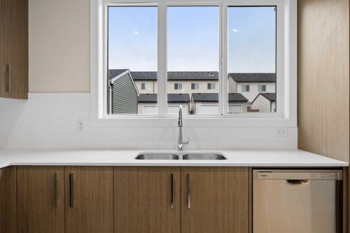 536 Chelsea Gardens, Chestermere, AB - Indoor Photo Showing Kitchen With Double Sink