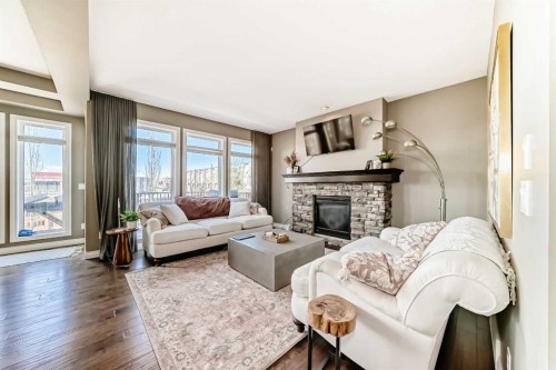7 Westland Manor Sw, Calgary, AB - Indoor Photo Showing Living Room With Fireplace