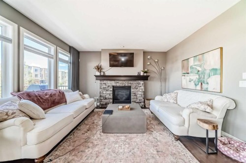 7 Westland Manor Sw, Calgary, AB - Indoor Photo Showing Living Room With Fireplace