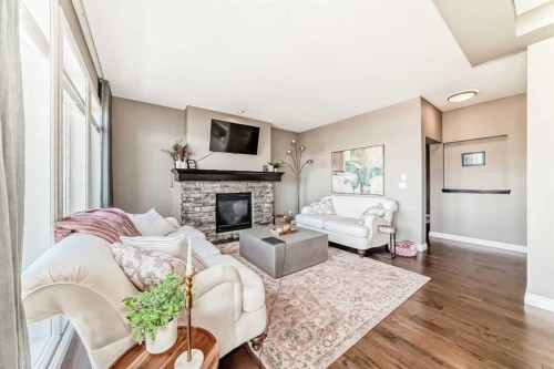 7 Westland Manor Sw, Calgary, AB - Indoor Photo Showing Living Room With Fireplace