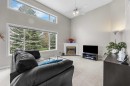 33 Country Hills Cove Nw, Calgary, AB  - Indoor Photo Showing Living Room With Fireplace 
