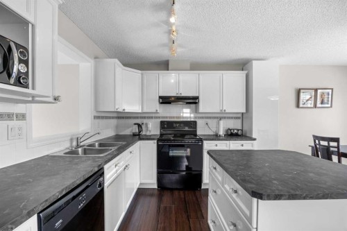 33 Country Hills Cove Nw, Calgary, AB - Indoor Photo Showing Kitchen With Double Sink